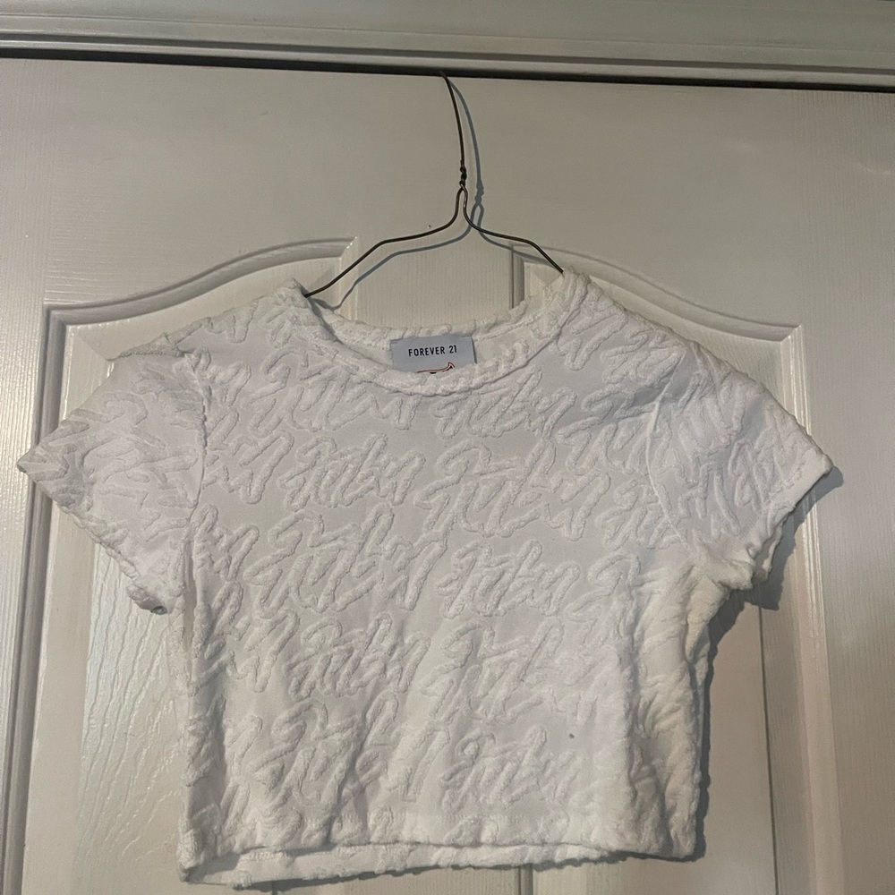 White crop top with words all over it